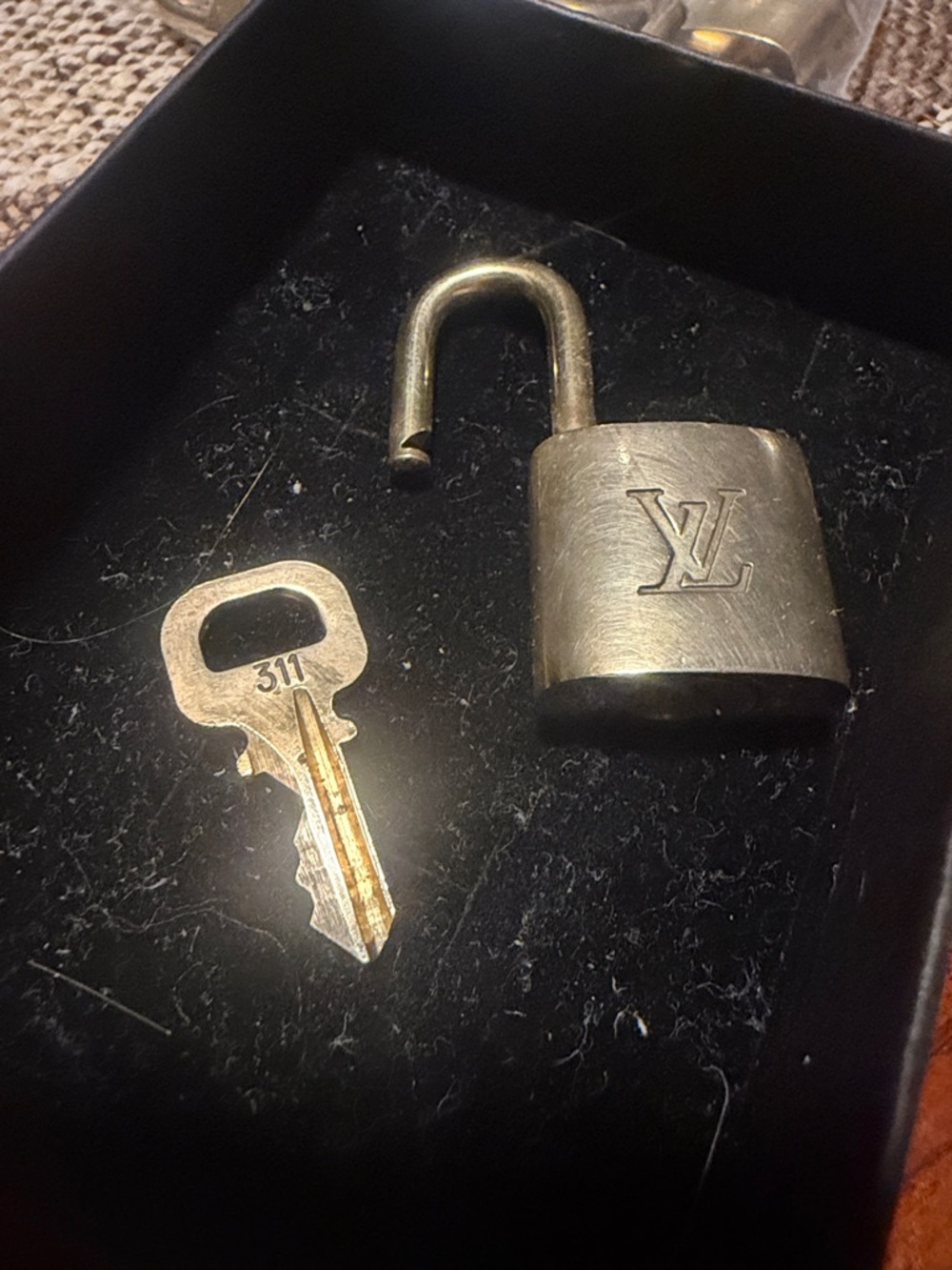 #311. Louis Vuitton Gold-Tone Padlock and Key